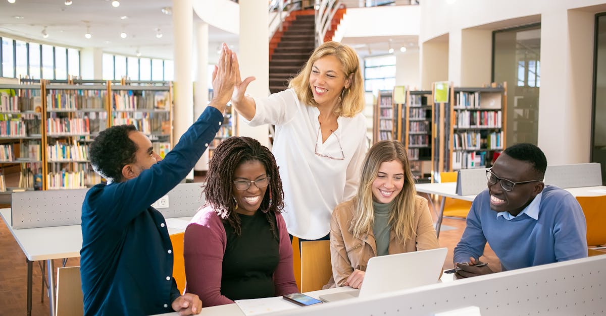 Diverse multiethnic students collaborating together in university library